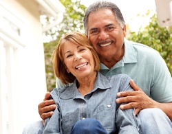 Couple sharing smiles with All-On-4 dental implants in Thorndale