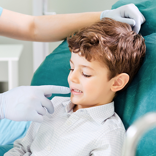 Little boy being examined by a dentist