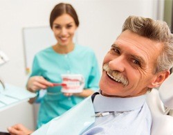 An older man at the dentist office for dental checkup and teeth cleaning