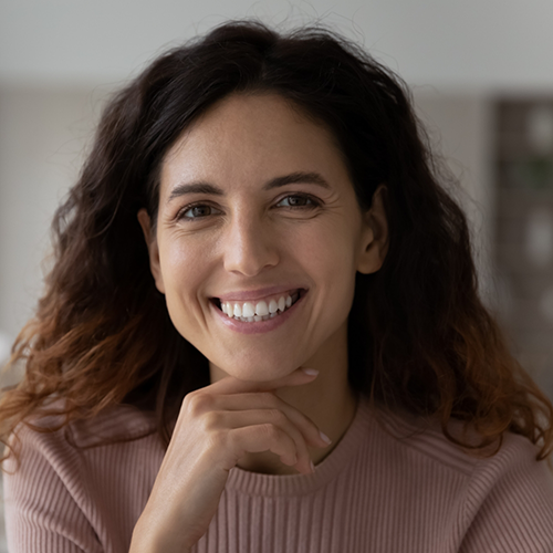 Close up of smiling woman in a sweater