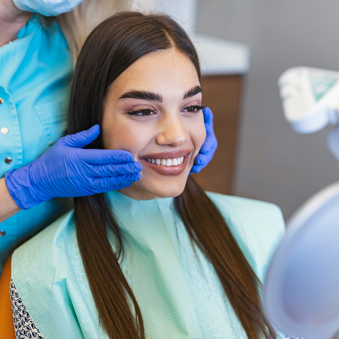 Close up of woman in dental chair smiling
