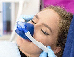 Woman with nitrous oxide dental sedation mask