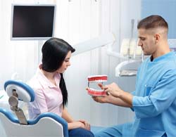 Patient listening to emergency dentist in Thorndale