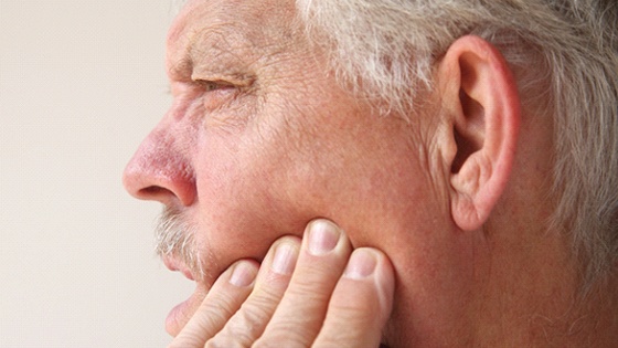 Man with dental implant failure before salvage in Thorndale