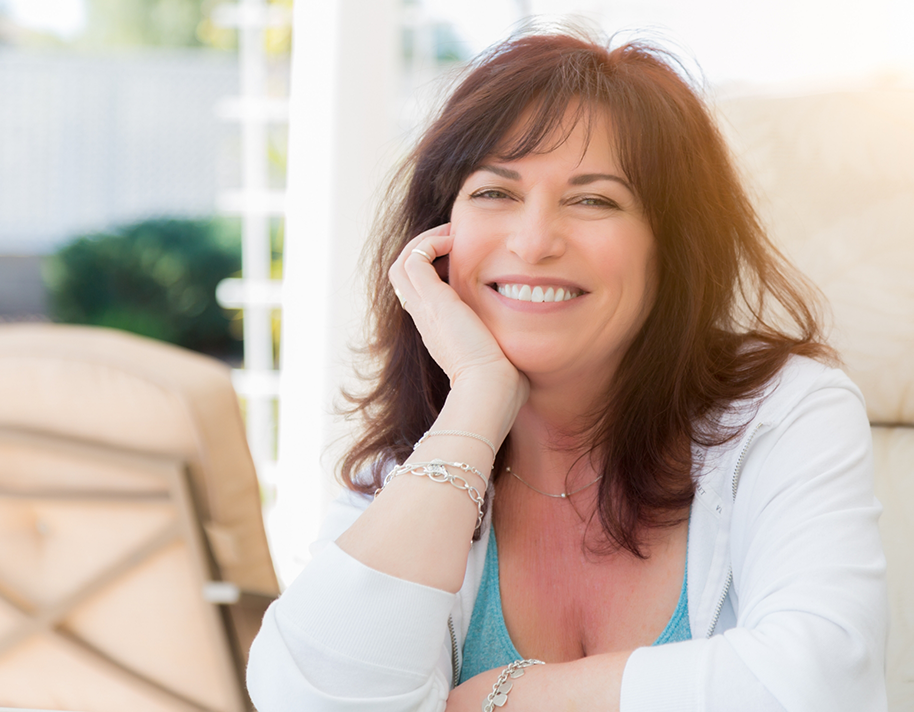 Woman in white shirt smiling