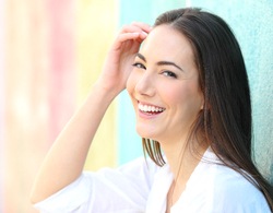 Woman with beautiful smile after full mouth reconstruction