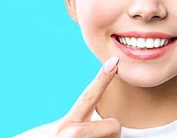 Woman pointing to smile in Thorndale