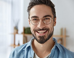 Young man with dental implants in Thorndale