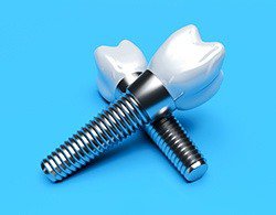 Closeup of two dental implants in Coatesville on blue background