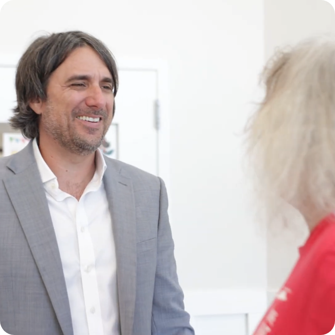Dr. Simeone talking with a patient about implant care