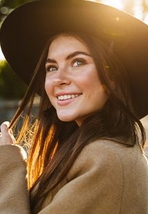 Woman with flawless smile after cosmetic dentistry