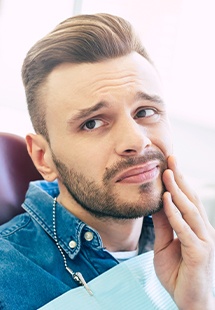 Man in pain before emergency dentistry