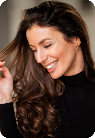 Woman with flawless smile after cosmetic dentistry