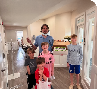 Dr. Simeone with his sons at the office