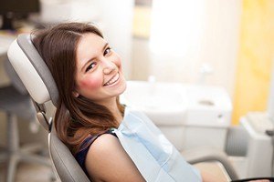 Smiling woman in dental chair