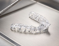 Clear nightguard for bruxism on metal tray