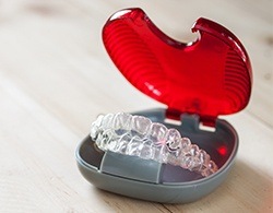 Set of Invisalign teen aligners in carrying case