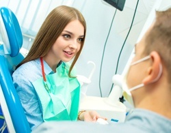 A female patient talking with her dentist about nightguards