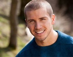 Smiling man after oral cancer screening