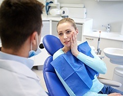 Woman talking to dentist about orthodontic treatment options