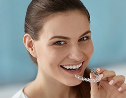 Woman placing Invisaligntray