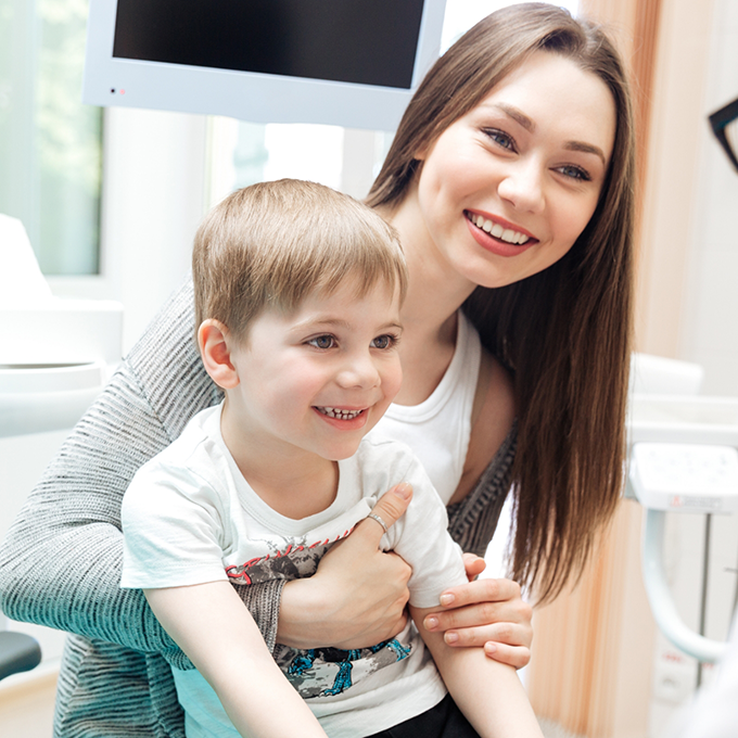 Young woman holding a child