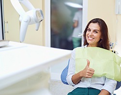 Happy patient giving thumbs up for dental sealants