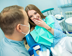 Relaxed female patient discussing sedation dentistry in Coatesville