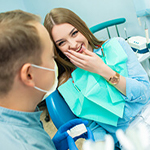 Relaxed female patient discussing sedation dentistry in Thorndale