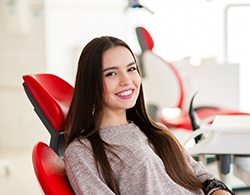 Smiling patient in a dental chair
