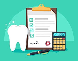 Tooth lying next to a calculator and a clipboard