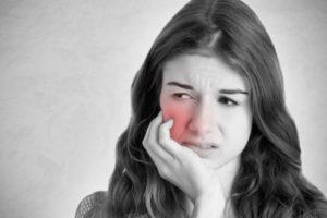 woman with sensitive tooth