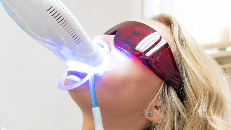 person getting teeth whitening after braces