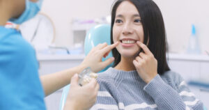 Woman at dental implant consultation asking if she's a good candidate