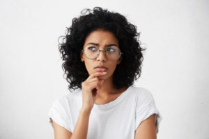 Woman wondering if it hurts to get Invisalign attachments removed