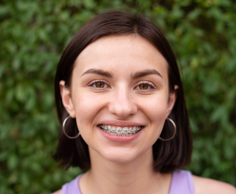 Girl with braces, smiling
