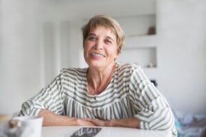 Older woman smiling with braces